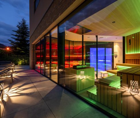 The outdoor area of the sauna at evening